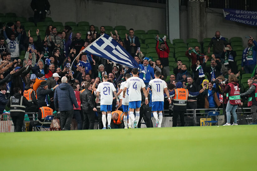 Greece fans at the Aviva Stadium celebrate Giorgios Giakoumakis' opening goal.
