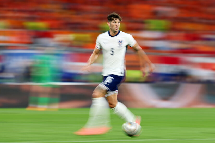 John Stones of England runs with the ball during the UEFA EURO 2024 semi-final match between Netherlands and England at Football Stadium Dortmund on July 10, 2024 in Dortmund, Germany.