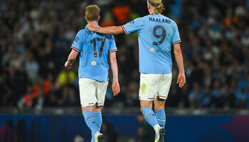 Kevin De Bruyne of Manchester City with his teammate Erling Haaland