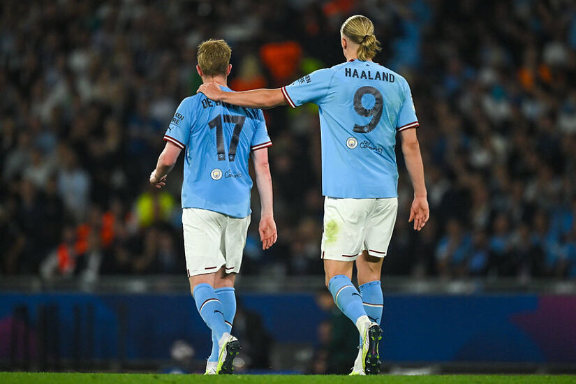 Kevin De Bruyne of Manchester City with his teammate Erling Haaland