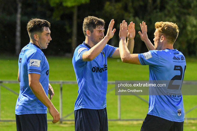 UCD's Colm Whelan is congratulated by team mates Paul Doyle and Liam Kerrigan.
