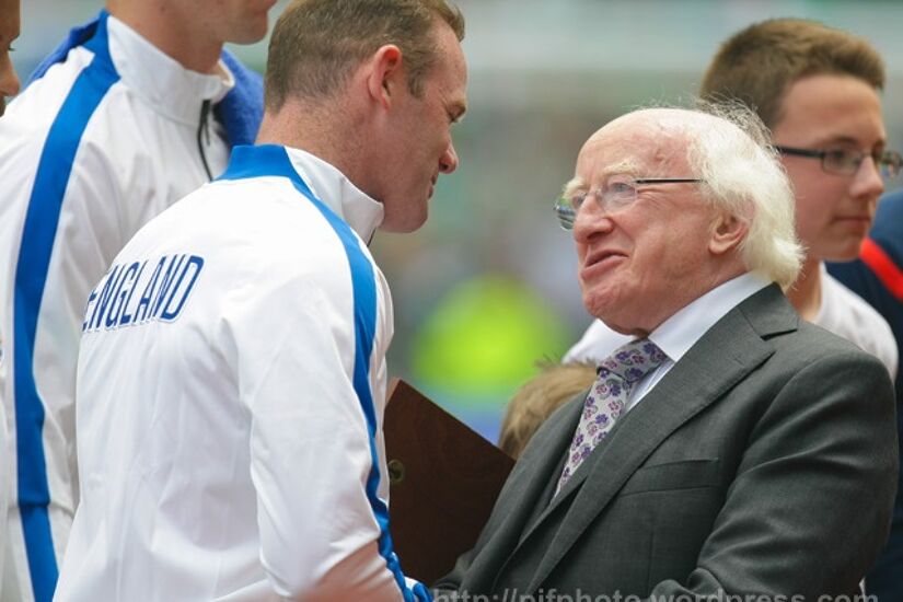 England captain Wayne Rooney is greeted by Ireland president Michael D Higgins ahead of a 2015 friendly at the Aviva Stadium.
