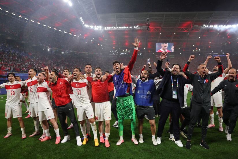 Players and Coaching Staff of Turkiye celebrate in front of the fans after the team's victory in the UEFA EURO 2024 round of 16 match between Austria and Turkiye at Football Stadium Leipzig on July 02, 2024 in Leipzig, Germany.