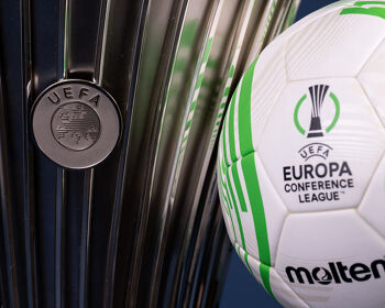 A view of the UEFA Europa Conference League 2022/23 Group Stage match ball next to the UEFA Europa Conference League trophy
