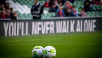 Liverpool's slogan You'll Never Walk Alone displayed at the Aviva Stadium for a benefit game in aid of Seán Cox.