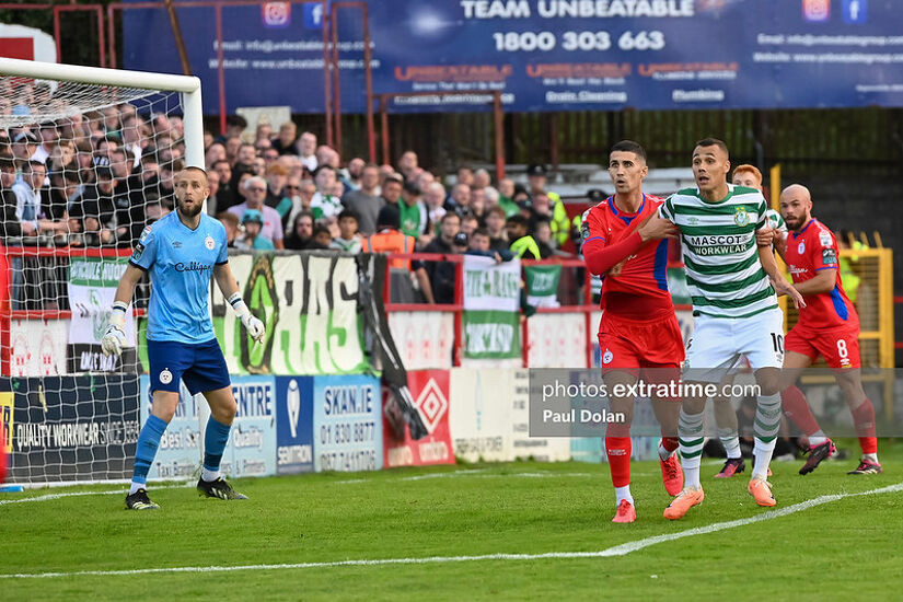Shamrock Rovers' Graham Burke marked by Shelbourne's Shane Griffin as Reds keeper Conor Kearns watches on during the sides game in Tolka Park last August