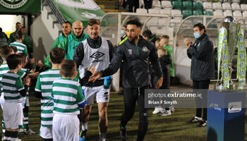 Shamrock Rovers captain Roberto Lopes greets a mascot as he takes the field at Tallaght Stadium.