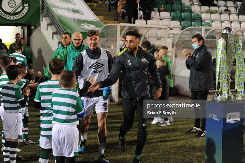 Shamrock Rovers captain Roberto Lopes greets a mascot as he takes the field at Tallaght Stadium.