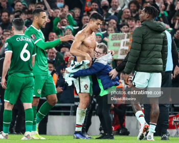 Ronaldo getting a hug from an Irish fan