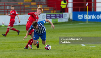 Shane Farrell of Shelbourne fouls Treaty United's Clyde O'Connell
