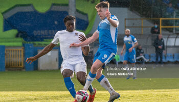 Mark Russell of Finn Harps controls the ball against Oluwatunmise Sobowale of Waterford.