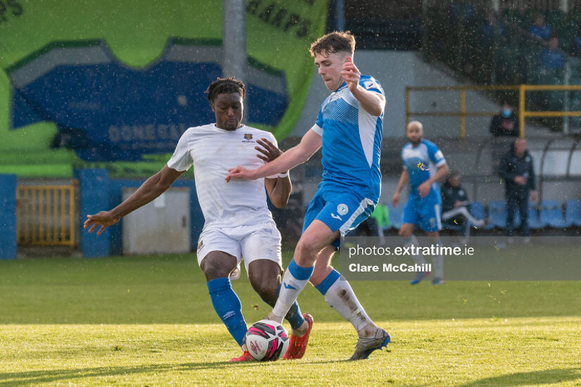 Mark Russell of Finn Harps controls the ball against Oluwatunmise Sobowale of Waterford.