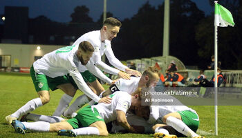 eam mates celebrate with Mitchell Byrne of Cabinteely FC after his late winner.