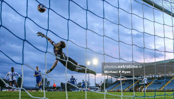 Paul Martin of Waterford fails to stop Michael Duffy of Dundalk scoring his sides third goal.