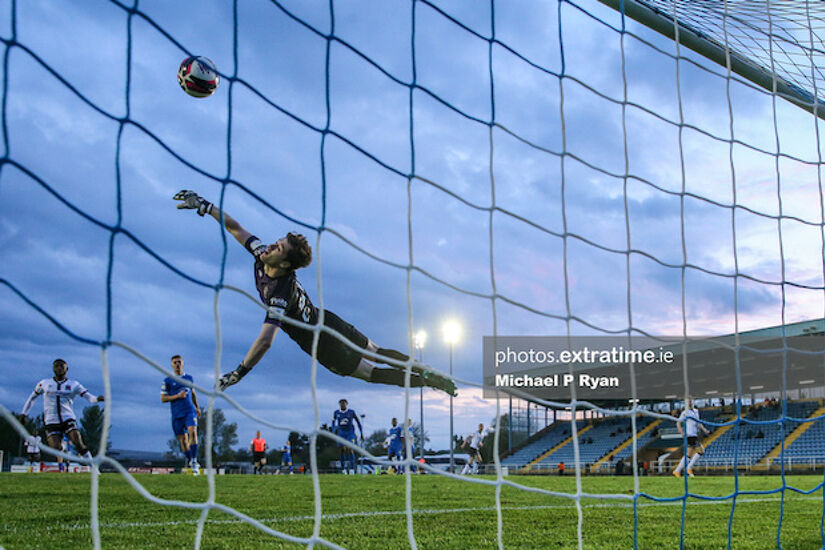 Paul Martin of Waterford fails to stop Michael Duffy of Dundalk scoring his sides third goal.