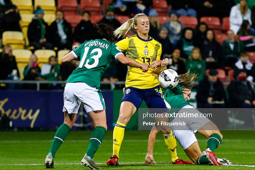 Amanda Ilestedt of Sweden tries to get a hold of the ball despite Áine O'Gorman and Katie McCabe (c) of Ireland
