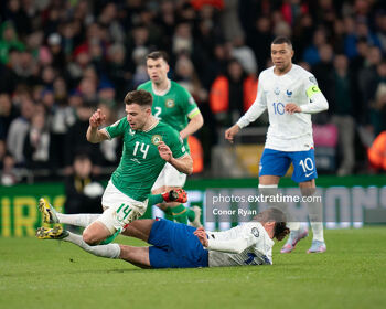 Adrien Rabiot of France slides in on Jason Mulumby of the Republic of Ireland
