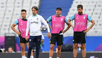 Lautaro Martinez (left) and Head Coach Simone Inzaghi look on during the Internazionale training session ahead of UEFA Champions League