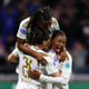 Kadidiatou Diani of Olympique Lyonnais celebrates scoring her team's third goal with teammates during the UEFA Women's Champions League 2023/24 Quarter Final Leg Two match between Olympique Lyon and SL Benfica at OL Stadium on March 27, 2024 in Lyon