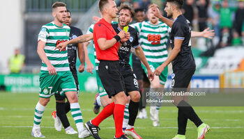 Rovers goalscorer from the first leg Dylan Watts watches on as Walid Hamidi gets his first of two bookings in Tallaght