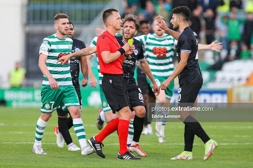 Rovers goalscorer from the first leg Dylan Watts watches on as Walid Hamidi gets his first of two bookings in Tallaght