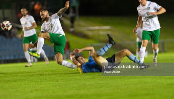 Cabinteely skipper Dan Blackbyrne clears up after UCD's Colm Whelan hits the deck