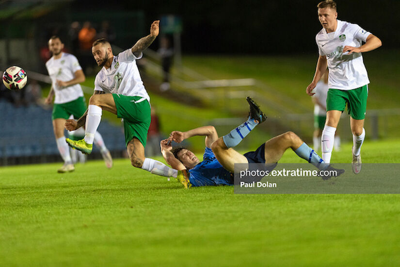 Cabinteely skipper Dan Blackbyrne clears up after UCD's Colm Whelan hits the deck