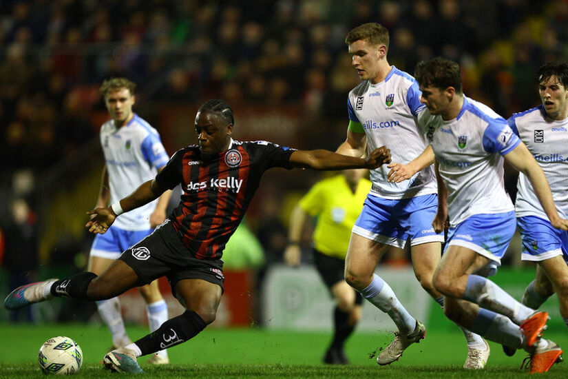 Jonathan Afolabi of Bohemian FC shooting towards goal against UCD