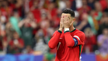 Cristiano Ronaldo of Portugal reacts after Jan Oblak of Slovenia (not pictured) saves his penalty kick during the UEFA EURO 2024 round of 16 match between Portugal and Slovenia at Frankfurt Arena on July 01, 2024 in Frankfurt am Main, Germany.