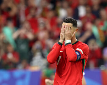 Cristiano Ronaldo of Portugal reacts after Jan Oblak of Slovenia (not pictured) saves his penalty kick during the UEFA EURO 2024 round of 16 match between Portugal and Slovenia at Frankfurt Arena on July 01, 2024 in Frankfurt am Main, Germany.