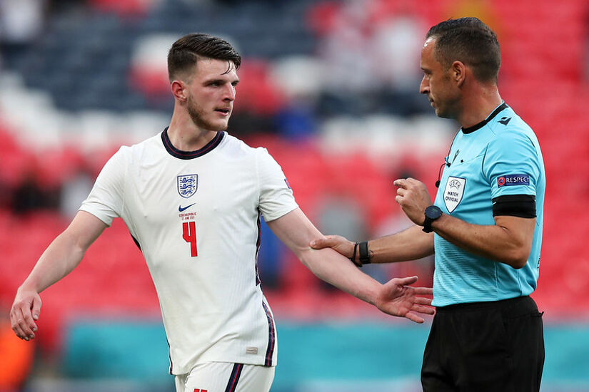 Referee Artur Dias speaking with former Republic of Ireland international Declan Rice during the UEFA Euro 2020 Championship Group D match between England and the Czech Republic at Wembley Stadium in June 2021.