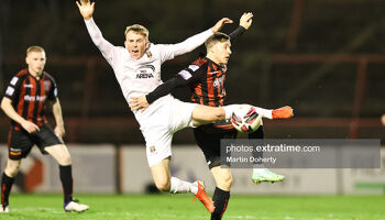 Darragh Power of Waterford FC and Liam Burt of Bohemian FC in action 