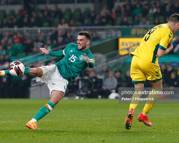 Troy Parrott strikes the ball during the game against Lithuania
