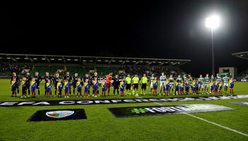 Players, match officials and mascots line up prior to the UEFA Conference League 2024/25 League Phase MD3 match between Shamrock Rovers FC and The New Saints FC at Tallaght Stadium in November 2024