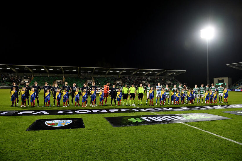 Players, match officials and mascots line up prior to the UEFA Conference League 2024/25 League Phase MD3 match between Shamrock Rovers FC and The New Saints FC at Tallaght Stadium in November 2024