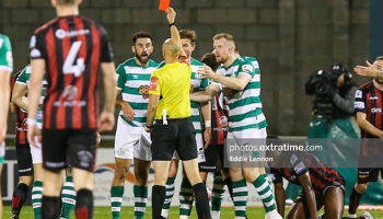 Roberto Lopes reacts to the red card shown to him by referee Neil Doyle