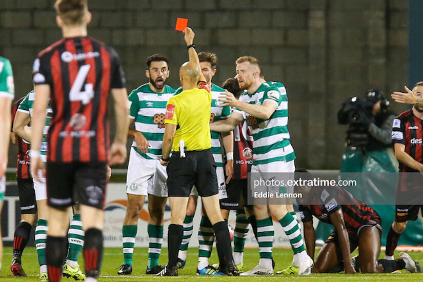 Roberto Lopes reacts to the red card shown to him by referee Neil Doyle