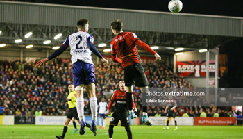 The Saints' Jack Scott and Bohs' Stephen Mallon challenge for a ball in the air on Monday, 28 February 2022.