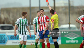 Sean McSweeney receives a red card from referee Oliver Moran