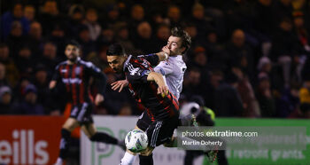 Kyrstian Nowak of Bohemian in action against Darragh Markey of Drogheda United