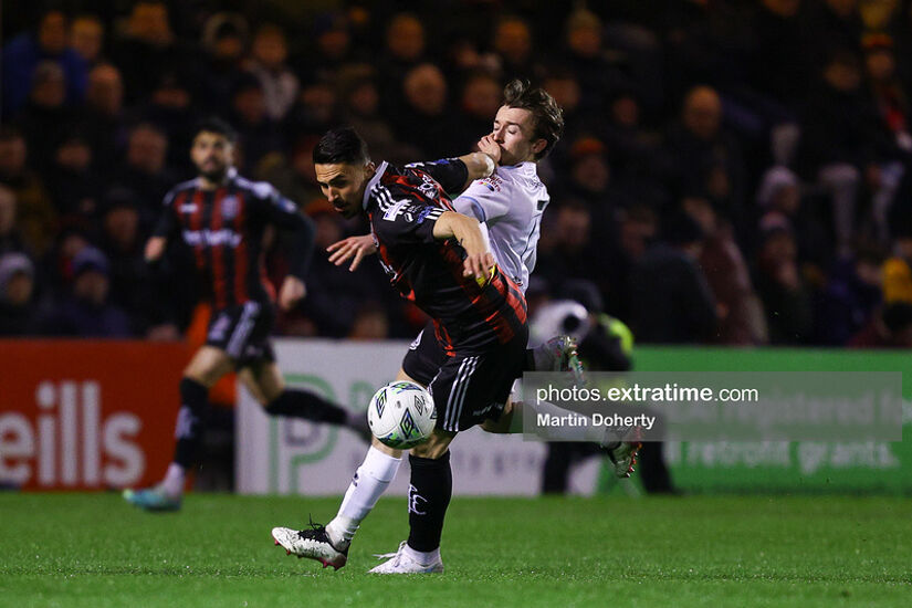 Kyrstian Nowak of Bohemian in action against Darragh Markey of Drogheda United