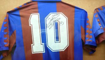 Diego Maradon'a signed Barcelona shirt on display at Camp Nou.