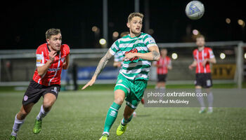Lee Grace races onto the ball with Joe Thomson for company during Derry City's 2-1 home win over Shamrock Rovers in February