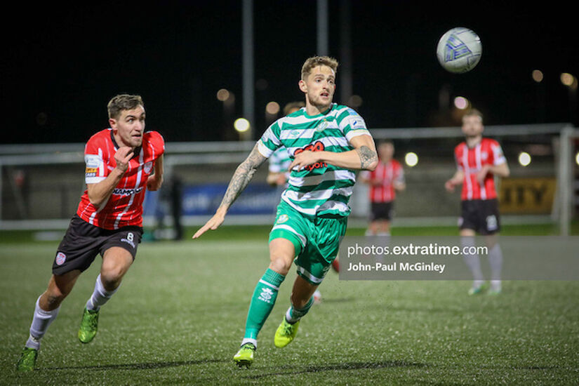 Lee Grace races onto the ball with Joe Thomson for company during Derry City's 2-1 home win over Shamrock Rovers in February