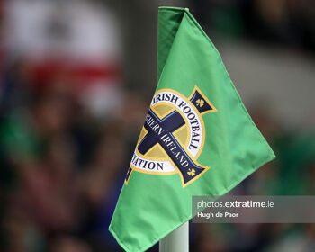 A corner flag emblazoned with the Northern Ireland logo.