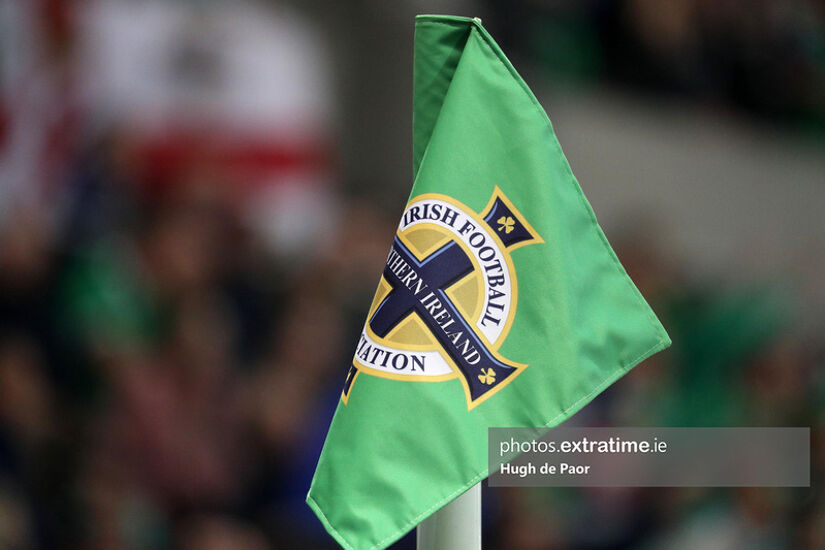 A corner flag emblazoned with the Northern Ireland logo.
