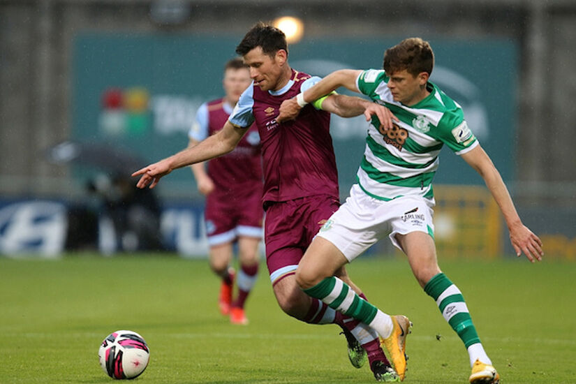 Dinny Corcoran and Sean Gannon battle for the ball in Tallaght 