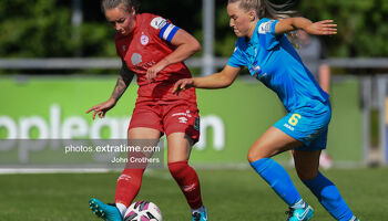Shels' Pearl Slattery is challenged by Fiona Donnelly of the Waves.