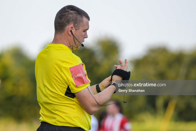 Assistant referee fixes his equipment, during the Athlone Town v Treaty United WFC WNL match at Athlone Town Stadium, Athlone.