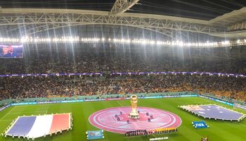 The French and Aussie teams line up ahead of kick-off in the Al Janoub Stadium